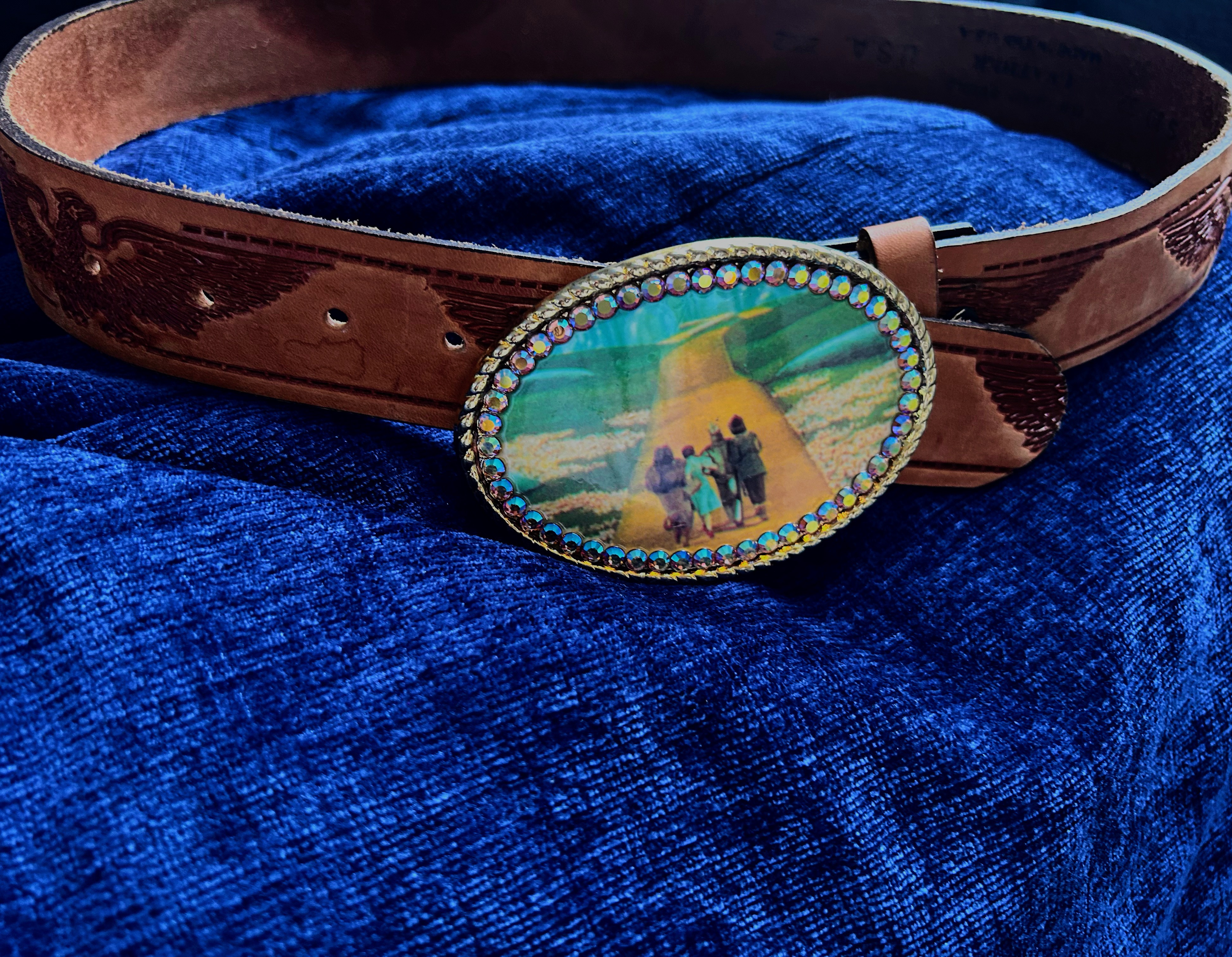 Wizard of Oz rhinestone encrusted belt with Dorothy and team on the yellow brick road